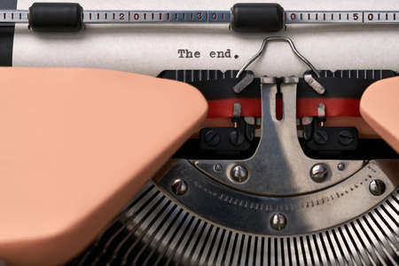 Vintage typewriter coral color in studio, close up.の写真素材