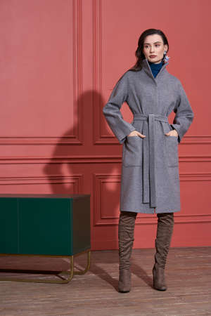 Model posing in studio in trendy clothesの写真素材