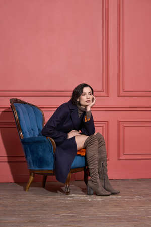 Model posing in studio in trendy clothesの写真素材