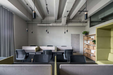 Stylish office in loft style with gray wallsの写真素材