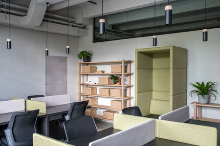 Stylish office in loft style with gray wallsの写真素材