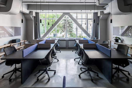 Stylish office in loft style with gray wallsの写真素材