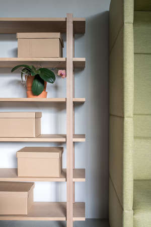 Stylish interior with wooden shelves and gray wallsの写真素材