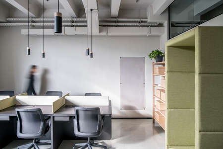 Stylish office in loft style with gray wallsの写真素材