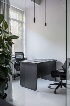 Stylish office in loft style with gray wallsの写真素材
