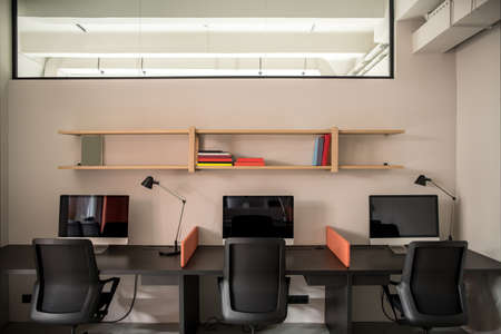 Stylish office in loft style with gray wallsの写真素材