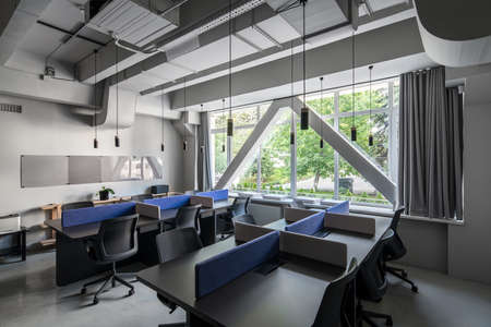Stylish office in loft style with gray wallsの写真素材