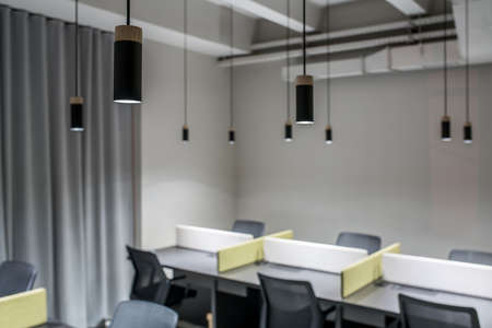 Stylish office in loft style with gray wallsの写真素材