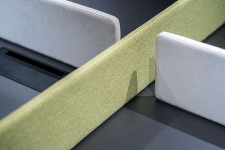 Closeup photo of the dark table with a gray and green partitions. Low aperture horizontal photo.の写真素材