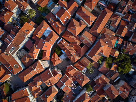 Old houses with red-orange roofs in Budva in Montenegroの写真素材