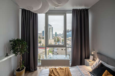Great bedroom in modern style with gray wall and luminous lampの写真素材