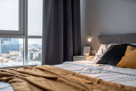 Great bedroom in modern style with gray wall and luminous lampの写真素材