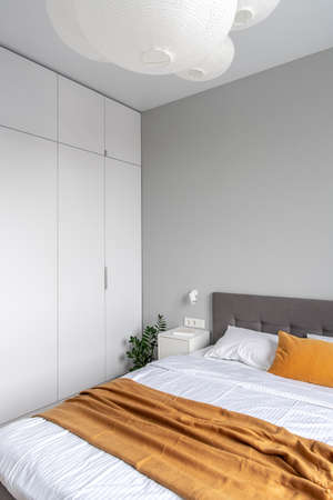 Great bedroom in modern style with light wallsの写真素材