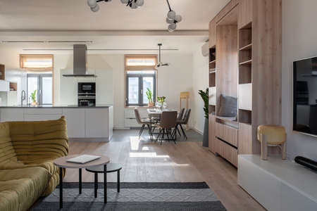 Sunny modern interior with white walls and kitchen zoneの写真素材