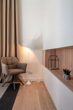 Stylish modern interior with white walls and luminous lampの写真素材