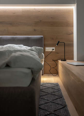 Stylish bedroom in modern style with luminous lampsの写真素材