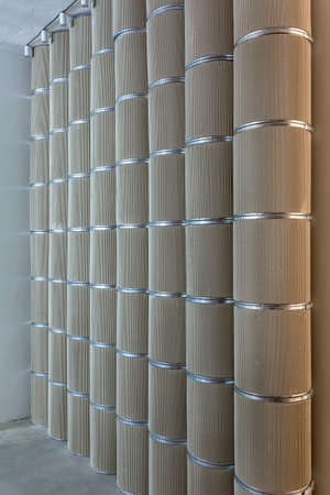 Beige textured columns with metal chrome ringsの写真素材