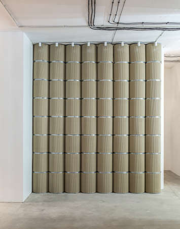Eight beige textured columns with the metal chrome ringsの写真素材