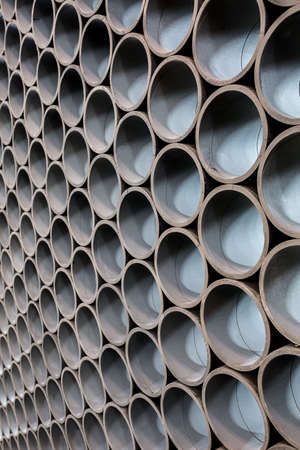 Dark gray partition made of a lot of the short pipesの写真素材