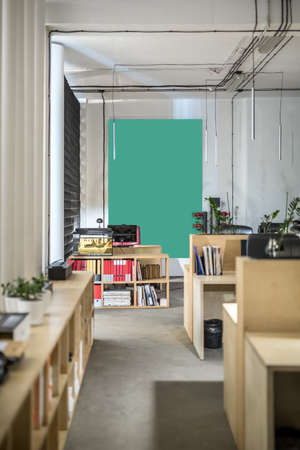 Workspace in a loft style with white walls and columnsの写真素材