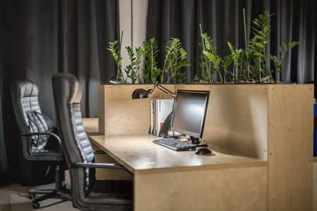 Glowing workplace in the office in a loft styleの写真素材