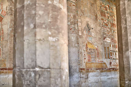 Ancient egyptian temple wall covered with hieroglyphics and images in Luxorの写真素材