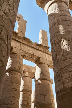 Ancient egyptian temple in Karnak with hieroglyphs on columnsの写真素材
