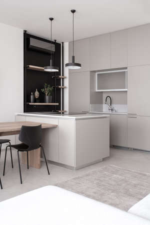 Stylish modern kitchen with light walls and gray floorの写真素材