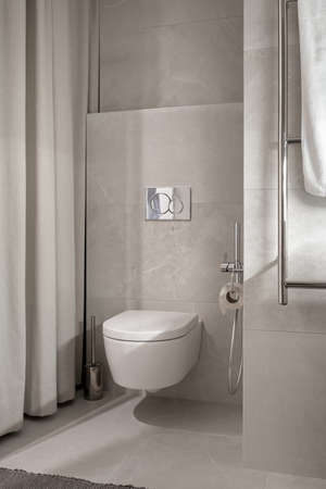 Stylish bathroom in modern style with tiled walls and illuminationの写真素材