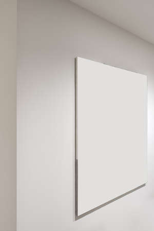 Luminous interior with white wall with hanging pictureの写真素材