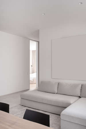 Stylish modern interior with white walls and gray floorの写真素材