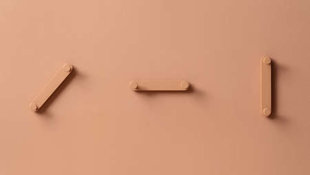 Fancy coral metal hangers on colorful wall in studioの写真素材