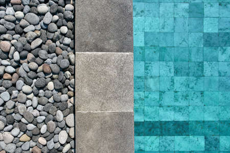 Closeup photo of pool edge which decorated with pebblesの写真素材