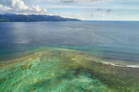 Tropical marine landscape of shallow sea on coastline backgroundの写真素材