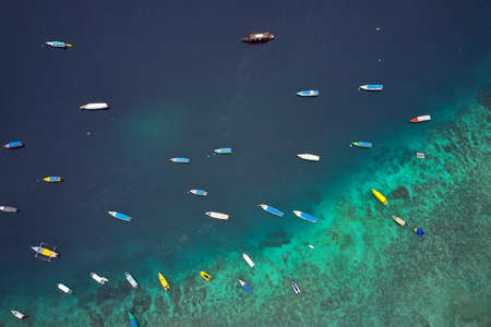 Top view at fishing boats in tropical sea in Indonesiaの写真素材