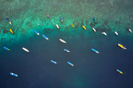 Top view at fishing boats in tropical sea in Indonesiaの写真素材