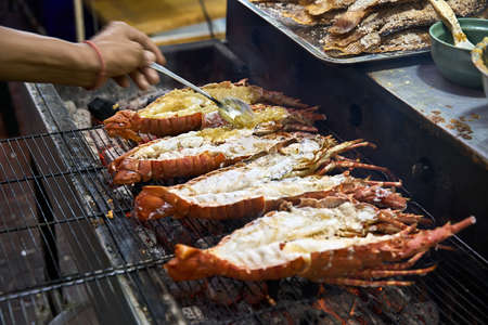 Grilled lobsters on street food market in Thailandの写真素材