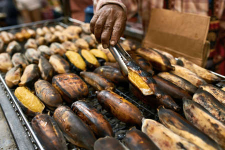 Street barbecue with grilled bananas in Thailandの写真素材