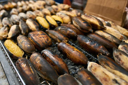 Street barbecue with grilled bananas in Thailandの写真素材