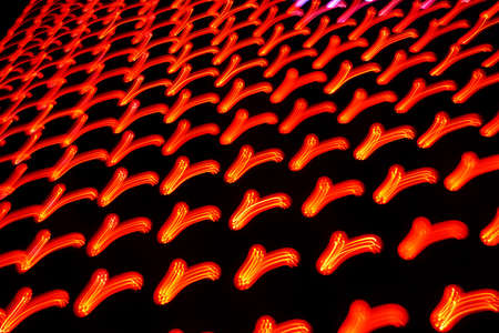 Long exposure photo of moving colorful neon light patternsの写真素材