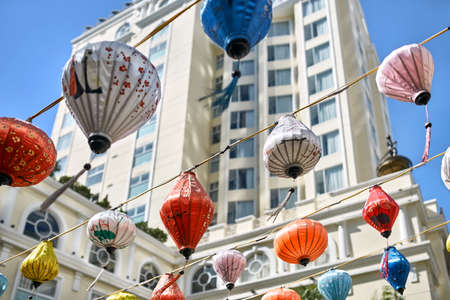 Asian city street decorated with traditional multicolored chinese lanternsの写真素材