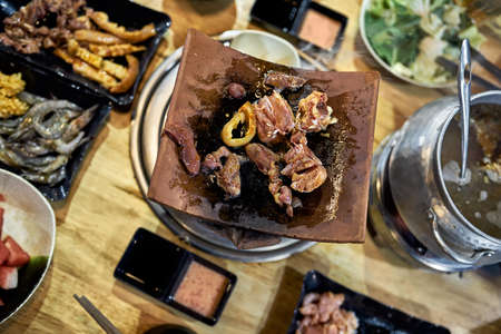 Traditional vietnamese hot spot restaurant with varied foodの写真素材