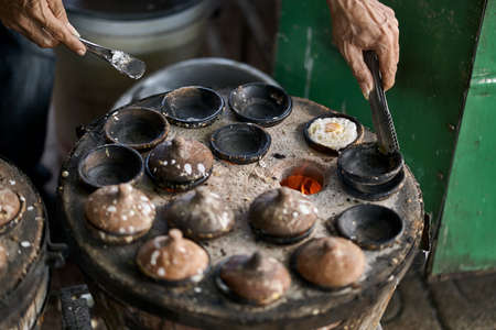 Street stone barbecue with grilled eggs in Vietnamの写真素材