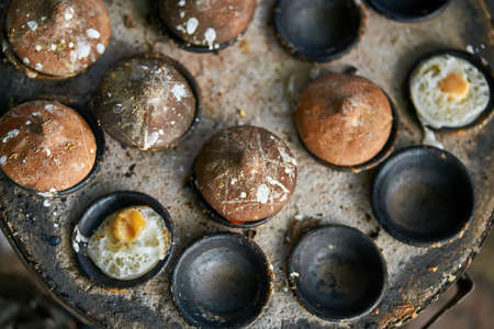 Street stone barbecue with grilled eggs in Vietnamの写真素材