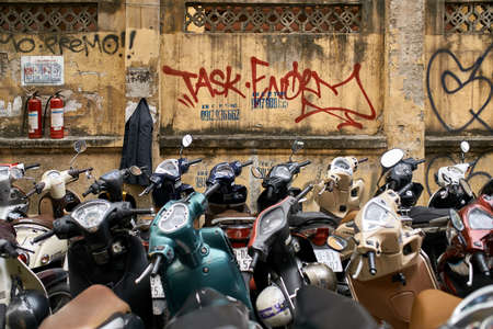 City street with many parked motorcycles at daylightのeditorial素材