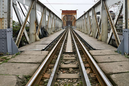 Old railroad bridge with rusty metal constructionsの写真素材