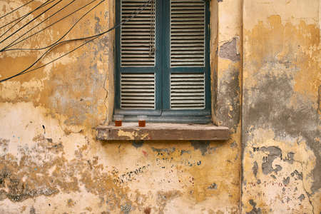 Exterior of vintage vietnamese house with shabby wallの写真素材