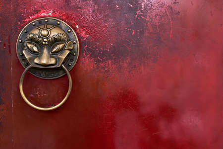 Fancy bronze handle in form of quaint headの写真素材