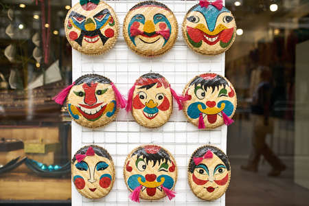Store with colorful emotional face bamboo masks in Hanoi