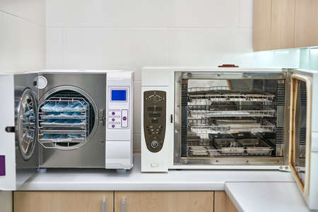 Sterilize machines with opened doors and dental tools insideの写真素材